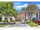 Street view of traditional townhouses with brick and siding, front gardens, and parking spots at 1344 Baez St, Raleigh, NC 27608