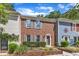 Traditional townhouses with brick and siding, accented by gray shutters and well-maintained front gardens at 1344 Baez St, Raleigh, NC 27608
