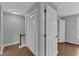 This hallway features white doors and wood-look floors at 1344 Baez St, Raleigh, NC 27608