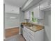 Kitchen view with white cabinets, stainless steel appliances, and granite countertops at 1344 Baez St, Raleigh, NC 27608