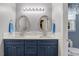 Modern bathroom features double sinks, quartz countertops and recessed lighting at 135 Crooked Creek Run, Louisburg, NC 27549
