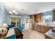 Dining area with wood cabinets and stainless steel appliances at 135 Crooked Creek Run, Louisburg, NC 27549