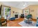The bright living room boasts a fireplace, vaulted ceiling, and lots of natural light at 135 Crooked Creek Run, Louisburg, NC 27549