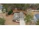 Aerial view of home with mature trees and meticulous landscaping at 138 Tramway Cir, Angier, NC 27501