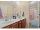 Bright bathroom features double sinks, and a shower with nice counter tops at 138 Tramway Cir, Angier, NC 27501