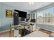 Bedroom featuring a gamer theme, a ceiling fan, and a large window allowing natural light at 138 Tramway Cir, Angier, NC 27501