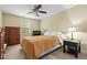 Cozy bedroom features neutral walls, a ceiling fan, and comfortable furnishings at 138 Tramway Cir, Angier, NC 27501