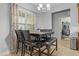 Dining room with modern chandelier lighting, a wooden table set, and tile flooring at 138 Tramway Cir, Angier, NC 27501