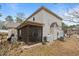 Rear exterior of home with screened in porch and manicured yard at 138 Tramway Cir, Angier, NC 27501