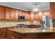 Lovely kitchen featuring granite countertops, stainless steel appliances, and a center island at 138 Tramway Cir, Angier, NC 27501