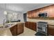 This beautiful kitchen has granite counters, stainless steel appliances, and tile backsplash at 138 Tramway Cir, Angier, NC 27501
