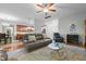 Inviting living room with hardwood floors, a comfortable leather sofa, and an open layout to the kitchen at 138 Tramway Cir, Angier, NC 27501