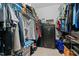 Walk-in closet with clothing racks, shelves, and a secure safe for valuables, providing ample storage at 138 Tramway Cir, Angier, NC 27501