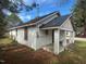 Side view of a white one-story home with a blue roof and a covered front porch at 1400 Hargrove St, Rocky Mount, NC 27801