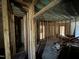 Interior view of a gutted home with exposed framing and concrete flooring at 1400 Hargrove St, Rocky Mount, NC 27801