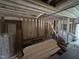 Interior view of a gutted home with exposed framing and concrete flooring at 1400 Hargrove St, Rocky Mount, NC 27801