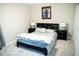 Bedroom with queen bed and two bedside tables with modern lamps at 141 Jones Franklin Rd # E, Raleigh, NC 27606