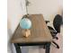 Wooden desk with blue globe and lamp at 141 Jones Franklin Rd # E, Raleigh, NC 27606
