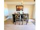 Warm dining room with a wooden table and chairs, accented by a chandelier, perfect for gatherings at 141 Jones Franklin Rd # E, Raleigh, NC 27606