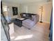 Living room with a large sectional sofa, decorative lighting, and modern decor that create an inviting atmosphere at 141 Jones Franklin Rd # E, Raleigh, NC 27606