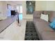 Relaxing living room featuring a comfortable sofa and stylish decor, designed for a cozy and inviting living space at 141 Jones Franklin Rd # E, Raleigh, NC 27606