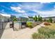 Gated community pool surrounded by lawn, landscaping, and townhome buildings at 1437 Newpoint Dr, Durham, NC 27713