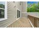 Wooden deck in backyard with siding and blue skies at 1437 Newpoint Dr, Durham, NC 27713