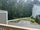 Scenic view from the back balcony, overlooking the lush backyard and parking area at 1437 Newpoint Dr, Durham, NC 27713