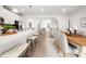 Bright, open concept kitchen with barstool seating flowing into a dining area and living space at 1437 Newpoint Dr, Durham, NC 27713