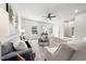 Cozy living room with neutral furniture, a ceiling fan, and bright windows for natural light at 1437 Newpoint Dr, Durham, NC 27713