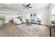 Open concept living area with bright light, stylish furnishings and seamless transition to kitchen at 1437 Newpoint Dr, Durham, NC 27713