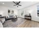 Bright living room featuring a ceiling fan, contemporary decor and stylish furniture at 1437 Newpoint Dr, Durham, NC 27713