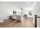 Bright, modern living room featuring wood floors, neutral walls, and comfortable seating and natural light at 1437 Newpoint Dr, Durham, NC 27713