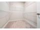 Walk-in closet features neutral carpet and metal storage shelves at 1437 Newpoint Dr, Durham, NC 27713