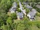 Aerial view of a lovely neighborhood with lush trees and manicured lawns, showing a peaceful suburban community at 1612 Rainesview Ln, Apex, NC 27502