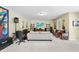 Spacious finished basement with music studio, entertaining space, and neutral colored carpet at 1612 Rainesview Ln, Apex, NC 27502