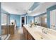 Bright bathroom boasts double vanity, glass enclosed shower, and separate tub at 1612 Rainesview Ln, Apex, NC 27502