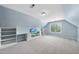 Spacious bonus room features natural light, built-in shelves and desk at 1612 Rainesview Ln, Apex, NC 27502