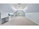 Bonus room featuring vaulted ceilings, built-in desk, and a large window at 1612 Rainesview Ln, Apex, NC 27502