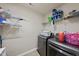 Convenient laundry room with shelving and modern washer and dryer at 1612 Rainesview Ln, Apex, NC 27502