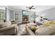 Cozy living room with fireplace, large sofa, and natural light at 1612 Rainesview Ln, Apex, NC 27502