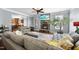Cozy living room with fireplace, large sofa, and natural light at 1612 Rainesview Ln, Apex, NC 27502