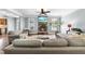 Cozy living room with fireplace, large sofa, and natural light at 1612 Rainesview Ln, Apex, NC 27502