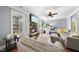 Cozy living room with fireplace, large sofa, and natural light at 1612 Rainesview Ln, Apex, NC 27502