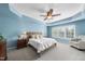 Spacious main bedroom with tray ceilings, soft blue walls, and plush carpeting at 1612 Rainesview Ln, Apex, NC 27502