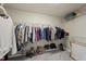 Walk-in closet with custom shelving and organizational systems at 1612 Rainesview Ln, Apex, NC 27502