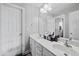 Bright, practical bathroom with double sink vanity and clean white cabinets at 1637 Dodford Ct, Wake Forest, NC 27587
