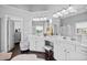 Bright bathroom features double vanity, makeup station, and sleek, modern finishes at 1637 Dodford Ct, Wake Forest, NC 27587