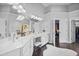 Bright bathroom features double vanity, makeup station, and sleek, modern finishes at 1637 Dodford Ct, Wake Forest, NC 27587