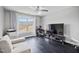 Comfortable bedroom setup featuring a soft couch and a large television at 1637 Dodford Ct, Wake Forest, NC 27587